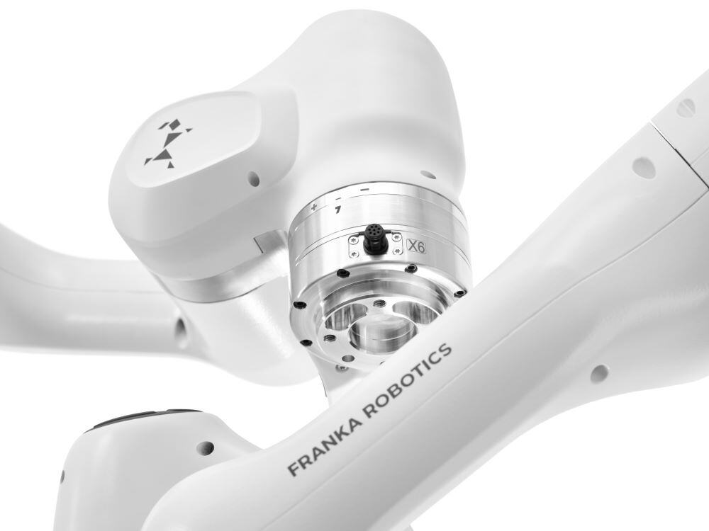 Mobile FR3 Duo robotic arm performing precise assembly tasks